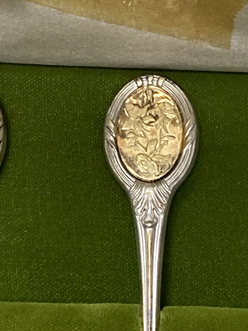 A modern cased set of twelve parcel gilt silver Royal Horticultural Society Flower Spoons by John Pinches,